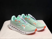 On Cloudsurfer Sneakers in Pale Green and White