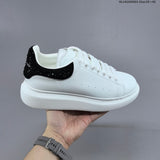 Alexander McQueen Oversized White Low-Top Sneakers with Black Heel