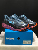 HOKA Stinson 7 Trail Running Shoes in Blue and Orange