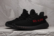 Yeezy Boost 350 V2 Black Knit Sneakers with Red Accents