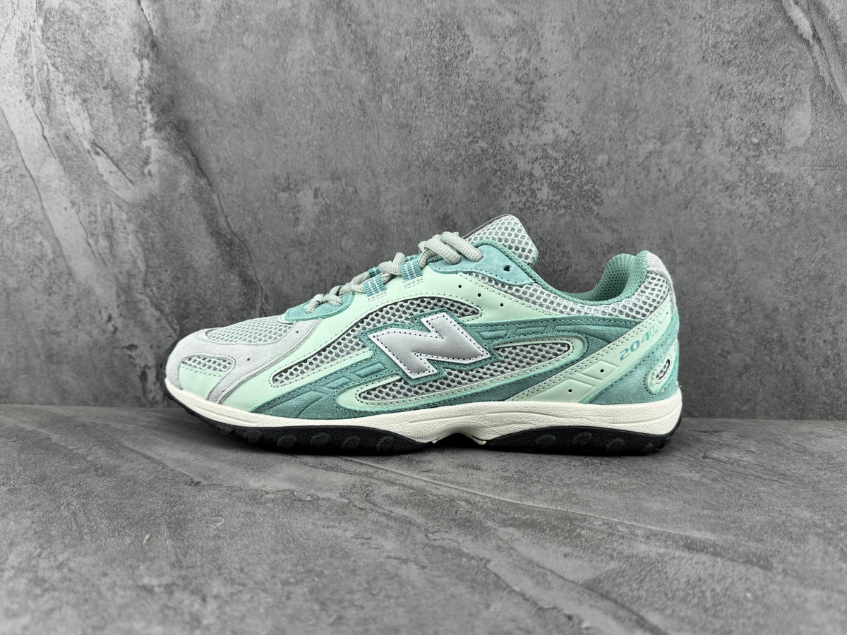 New Balance 204L Sneakers in Mint Green and Grey