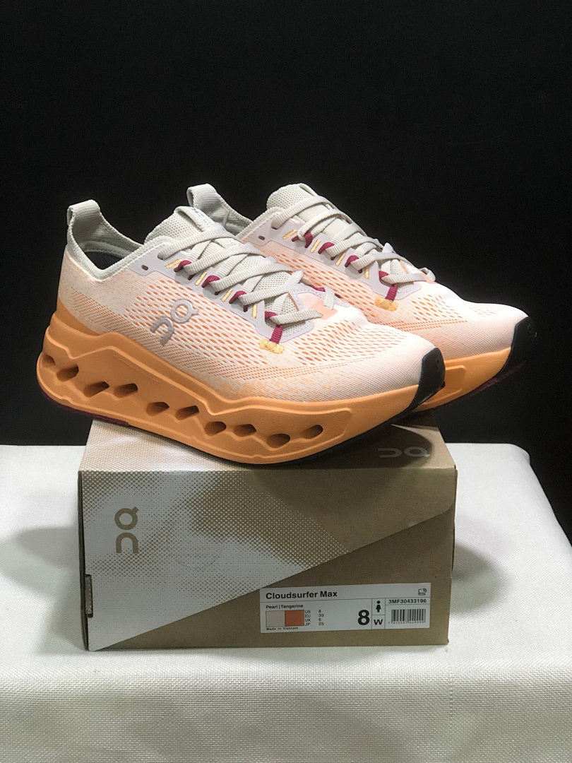 On Cloudsurfer Max Running Shoes in Pearl and Tangerine