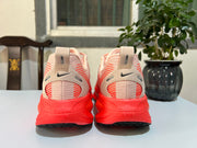 Nike Vomero 18 Running Shoes in Cream and Coral