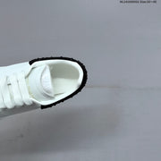Alexander McQueen Oversized White Low-Top Sneakers with Black Heel