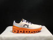 On Cloudmonster Running Shoes in Yellow Tan and Orange