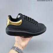 Alexander McQueen Oversized Low-Top Sneakers, Black and Gold, HLB331400405