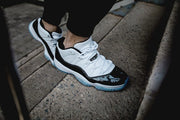Air Jordan 11 Iridescent Sneakers in White and Black