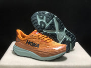 HOKA Stinson 7 Trail Running Shoes in Orange