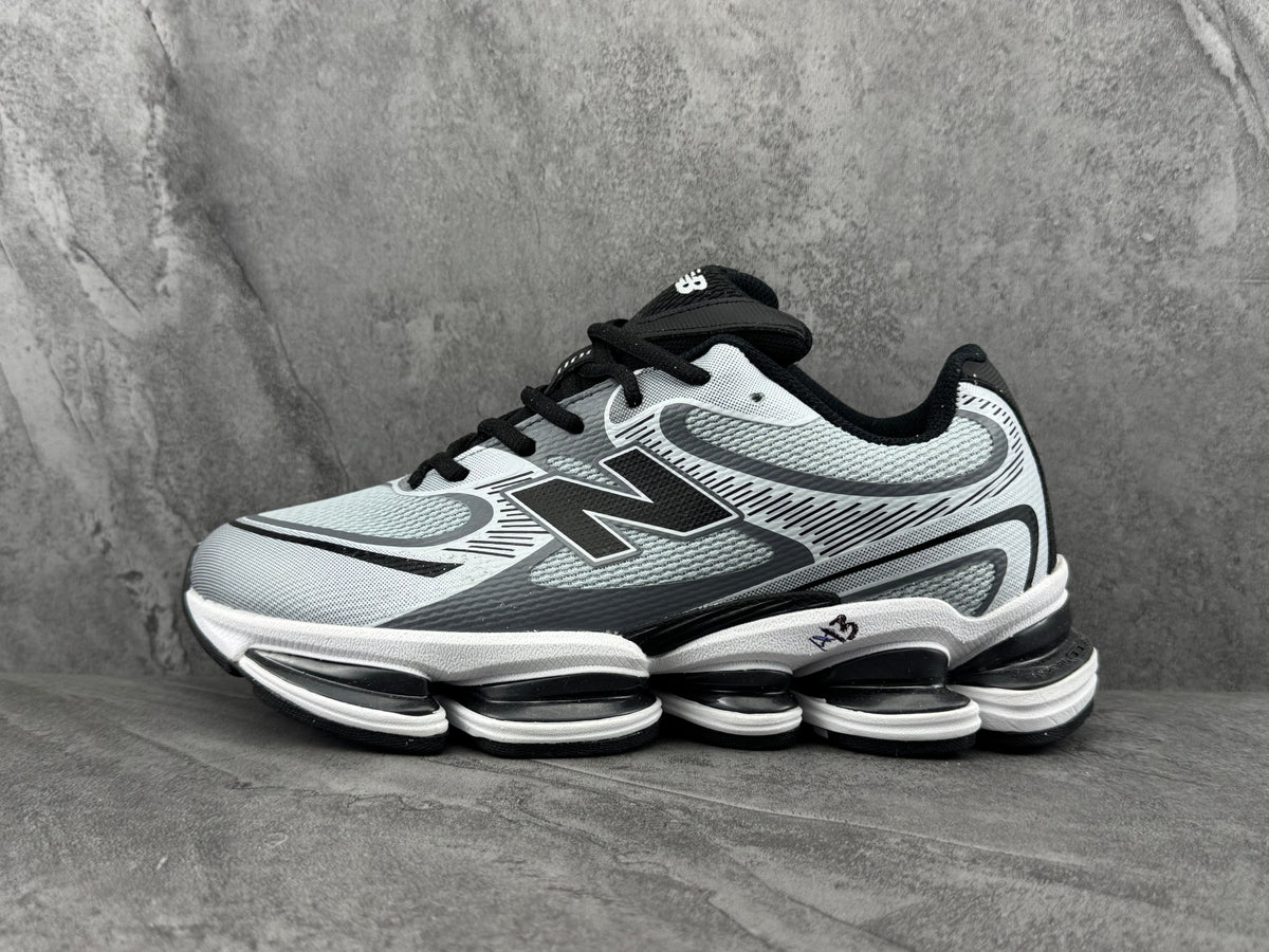New Balance Silver and Black Sneakers