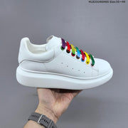 Alexander McQueen Oversized Low-Top Sneakers, Black and Gold, HLB331400405