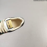 Gucci Screener Low-Top Sneakers in Black and White